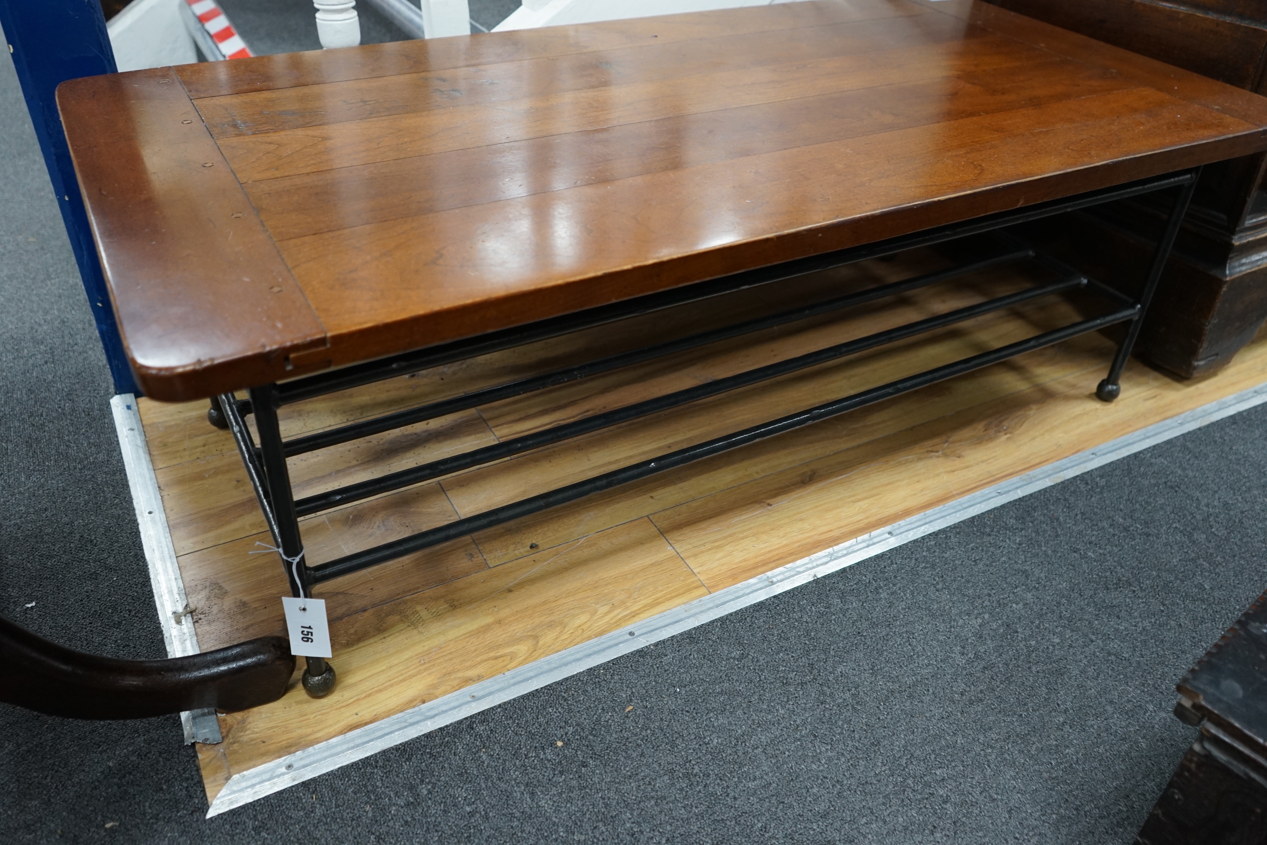 A modern rectanguar walnut and wrought iron coffee table, width 122cm depth 61cm height 41cm